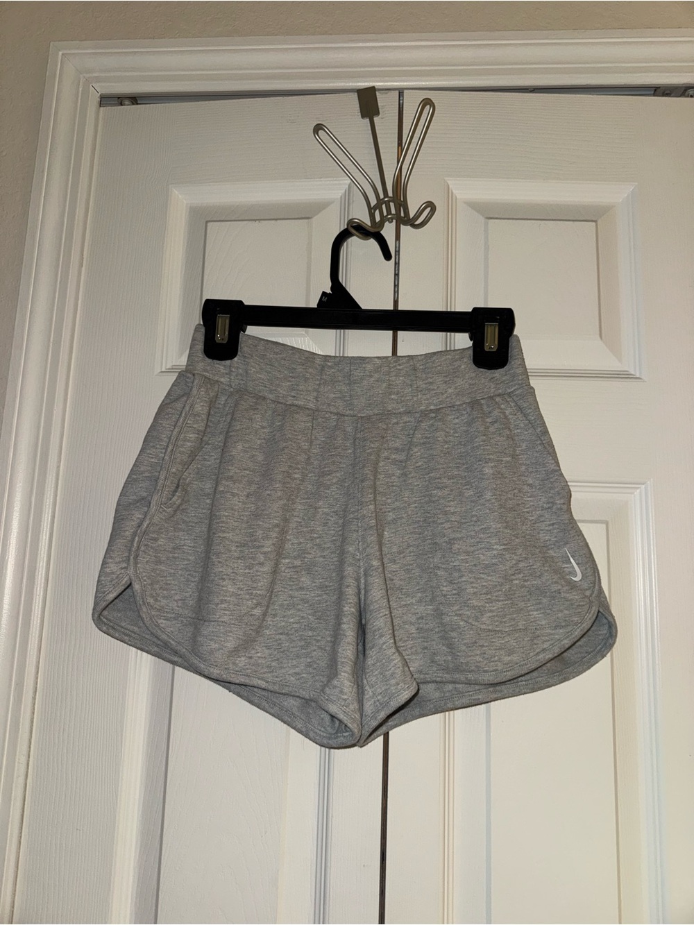 Nike Womenβs Light Gray Athletic Shorts with Swoosh